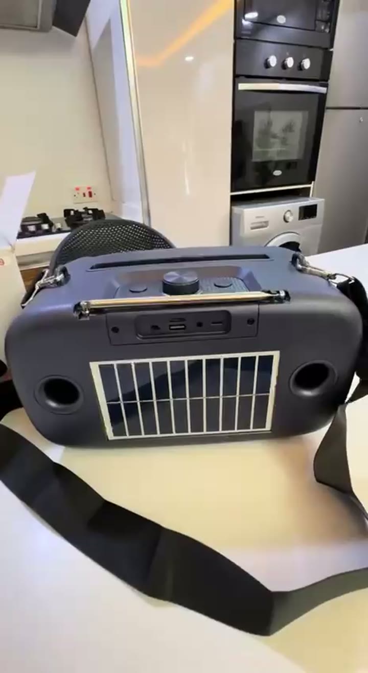 Xmacoz solar radio speaker with solar panel and carrying strap